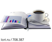 Открытый ежедневник, чашка кофе и экономические  цветные графики. Стоковое фото, фотограф Vitas / Фотобанк Лори