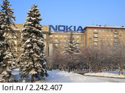 Реклама фирмы Nokia на здании в Новосибирске зимой (2010 год). Редакционное фото, фотограф Григорий Писоцкий / Фотобанк Лори