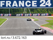 Болид Формула 2.0 участвует в чемпионате "Мировая серия Renault" на треке "Moscow Raceway" в Подмосковье (2012 год). Редакционное фото, фотограф Николай Винокуров / Фотобанк Лори