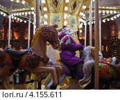 Новогодняя Страсбургская ярмарка в Москве. Карусели. Манеж (2012 год). Редакционное фото, фотограф Victoria Demidova / Фотобанк Лори