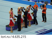 Чемпионат Европы по спортивной гимнастике 2013 года. Москва, СК "Олимпийский". Награждение победителей состязаний на перекладине - Эмин Гарибов, Сэм Олдэм (Sam Oldham) и Александр Царевич. Редакционное фото, фотограф Игорь Долгов / Фотобанк Лори
