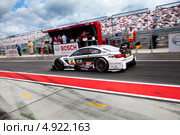 Автомобиль BMW M3 DTM команды BMW Team MTEK участвует в гоночной серии кузовных автомобилей Deutsche Tourenwagen Mastersна на трассе Moscow Raceway в Подмосковье 3 августа 2013. Редакционное фото, фотограф Николай Винокуров / Фотобанк Лори
