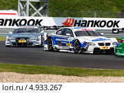 Автомобиль BMW M3 DTM команды BMW Team Schnitzer (гонщик Dirk Werner) участвует в гоночной серии кузовных автомобилей Deutsche Tourenwagen Masters на трассе Moscow Raceway в Подмосковье 3 августа 2013. Редакционное фото, фотограф Николай Винокуров / Фотобанк Лори