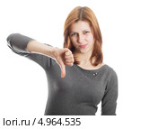Молодая женщина показывает знак неодобрения, изолированно на белом фоне. Стоковое фото, фотограф oleksandr gurin / Фотобанк Лори
