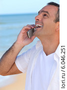 Mature man laughing into his cellphone. Стоковое фото, фотограф Phovoir Images / Фотобанк Лори