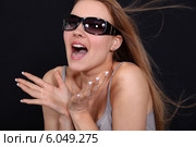 Excited woman wearing sunglasses. Стоковое фото, фотограф Phovoir Images / Фотобанк Лори
