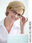 Secretary holding glasses. Стоковое фото, фотограф Phovoir Images / Фотобанк Лори