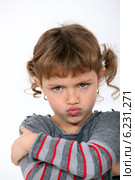 Angry little girl grinning. Стоковое фото, фотограф Phovoir Images / Фотобанк Лори