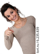 Woman giggling and pointing. Стоковое фото, фотограф Phovoir Images / Фотобанк Лори
