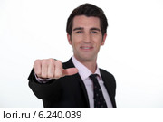 Businessman sticking out his thumb. Стоковое фото, фотограф Phovoir Images / Фотобанк Лори