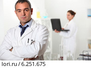 a scientist and his assistant. Стоковое фото, фотограф Phovoir Images / Фотобанк Лори