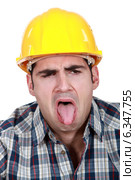 Construction worker with his tongue out. Стоковое фото, фотограф Phovoir Images / Фотобанк Лори