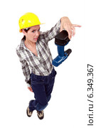 Confused woman with drill. Стоковое фото, фотограф Phovoir Images / Фотобанк Лори