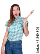 Shocked woman holding paint brush. Стоковое фото, фотограф Phovoir Images / Фотобанк Лори