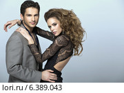 Calm young man with rapacious woman. Стоковое фото, агентство Ingram Publishing / Фотобанк Лори