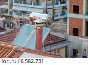 Солнечный коллектор на крыше дома, Греция (2014 год). Стоковое фото, фотограф Ольга Коцюба / Фотобанк Лори