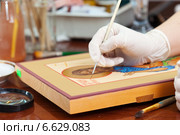 Iconographer paints of new icon with brush. Стоковое фото, фотограф Яков Филимонов / Фотобанк Лори