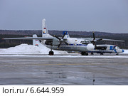 Самолет авиакомпании Катэкавиа Ан-24РВ на стоянке в аэропорту "Емельяново", Красноярск (2013 год). Редакционное фото, фотограф Алексей Гусев / Фотобанк Лори