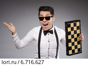 Funny chess player with board. Стоковое фото, фотограф Elnur / Фотобанк Лори
