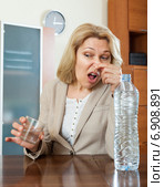 Sad mature woman with poor quality water. Стоковое фото, фотограф Яков Филимонов / Фотобанк Лори