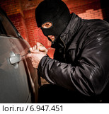 Car thief in a mask. Стоковое фото, фотограф Андрей Армягов / Фотобанк Лори