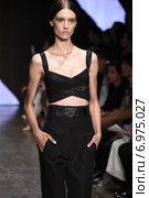 NEW YORK, NY - SEPTEMBER 08: A model walks the runway at Donna Karan New York during Mercedes-Benz Fashion Week Spring 2015 on September 8, 2014 in New York City. Редакционное фото, фотограф Anton Oparin / Фотобанк Лори
