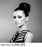 Portrait of beautiful sensual woman with elegant hairstyle. Perfect makeup. Стоковое фото, агентство Ingram Publishing / Фотобанк Лори
