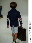 NEW YORK, NY - OCTOBER 19: A model walks the runway during the Clarks preview at petitePARADE Kids Fashion Week at Bathhouse Studios on October 19, 2014 in New York City. Редакционное фото, фотограф Anton Oparin / Фотобанк Лори