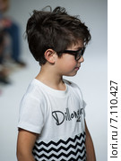NEW YORK, NY - OCTOBER 19: A model walks the runway during the Dillonger Clothing preview at petitePARADE Kids Fashion Week at Bathhouse Studios on October 19, 2014 in New York City. Редакционное фото, фотограф Anton Oparin / Фотобанк Лори