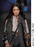 NEW YORK, NY - FEBRUARY 18: Model Sung Hee walks the runway at the Anna Sui fashion show during MBFW Fall 2015 at Lincoln Center on February 18, 2015 in NYC. Редакционное фото, фотограф Anton Oparin / Фотобанк Лори