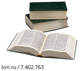 Открытый словарь и стопка из двух книг на белом фоне. Стоковое фото, фотограф Алексей Голованов / Фотобанк Лори