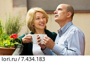 Mature couple on balcony with coffee. Стоковое фото, фотограф Яков Филимонов / Фотобанк Лори