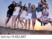 Group of young people enjoy summer  party at the beach. Стоковое фото, фотограф Benis Arapovic / PantherMedia / Фотобанк Лори