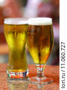 two glasses of fresh bier. Стоковое фото, фотограф daniel guffanti / PantherMedia / Фотобанк Лори