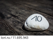 Table number ten written on a stone. Стоковое фото, фотограф Rüdiger Wittmann / PantherMedia / Фотобанк Лори