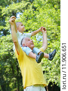 happy grandfather and child in park. Стоковое фото, фотограф Benis Arapovic / PantherMedia / Фотобанк Лори