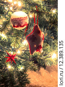 christmas tree with ornaments balls. Стоковое фото, фотограф Nicola Galiero / PantherMedia / Фотобанк Лори