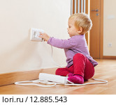 Baby playing with electrical extension. Стоковое фото, фотограф Яков Филимонов / Фотобанк Лори