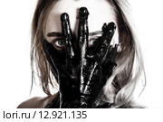 Woman holding a tarred hand on her face. Стоковое фото, фотограф Art Konovalov / Фотобанк Лори
