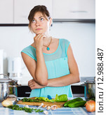 Sad housewife cooking dinner. Стоковое фото, фотограф Яков Филимонов / Фотобанк Лори