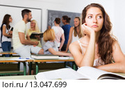 Lonely sad student in the classroom. Стоковое фото, фотограф Яков Филимонов / Фотобанк Лори