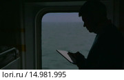 Man using touch pad during the cruise. Стоковое видео, видеограф Данил Руденко / Фотобанк Лори