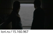 Couple looking at sea from a cabin of the cruise ship. Стоковое видео, видеограф Данил Руденко / Фотобанк Лори