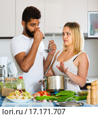 Interracial couple with stinking food. Стоковое фото, фотограф Яков Филимонов / Фотобанк Лори