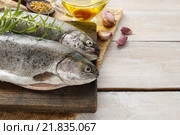 Two rainbow trouts on rustic wooden table, copy space. Стоковое фото, агентство BE&W Photo / Фотобанк Лори