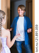 child receiving expected friend at home interior. Стоковое фото, фотограф Яков Филимонов / Фотобанк Лори