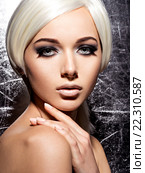 Woman's face with fashion black makeup of eye. silver background. Стоковое фото, фотограф Валуа Виталий / Фотобанк Лори