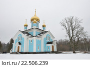 Голубая каменная православная церковь зимой в монастыре Никандрова Пустынь в Псковской области. Стоковое фото, фотограф Максим Мицун / Фотобанк Лори