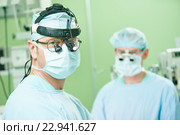 male cardiac surgeon at child cardiosurgery operating room. Стоковое фото, фотограф Дмитрий Калиновский / Фотобанк Лори