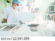 surgery and surgical tools at surgion operation in hospital. Стоковое фото, фотограф Дмитрий Калиновский / Фотобанк Лори